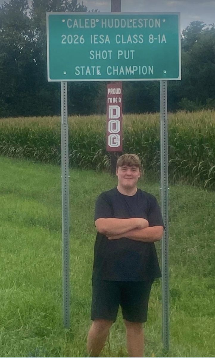 Caleb Huddleston and sign